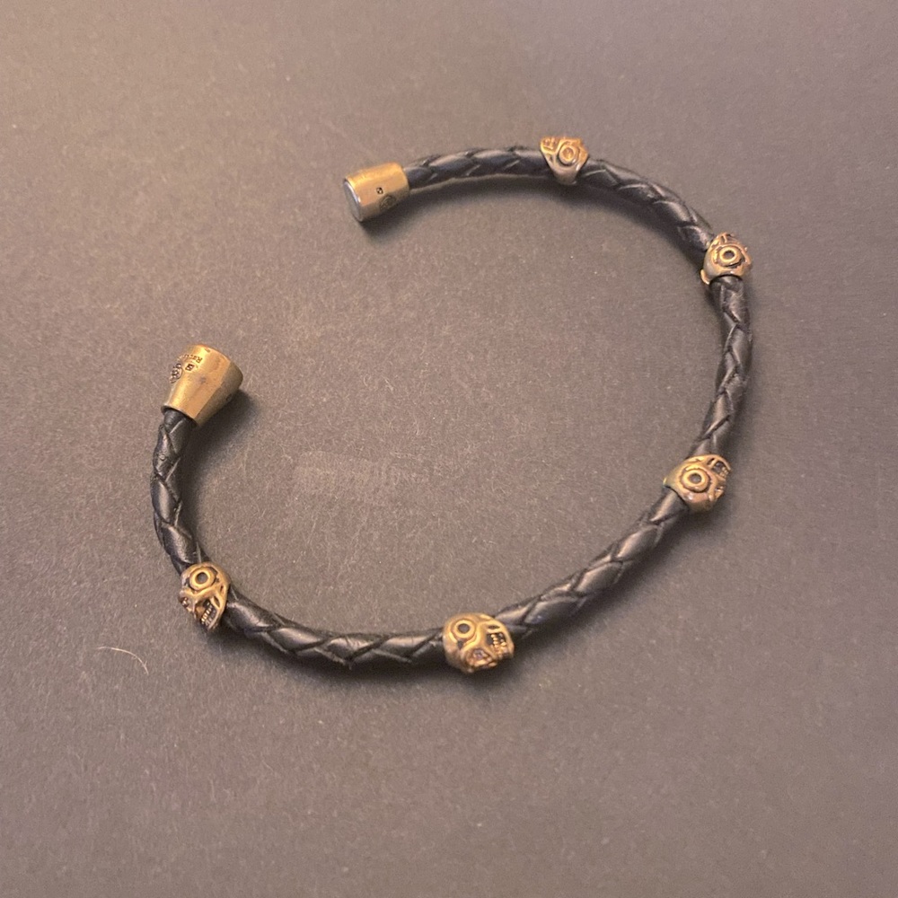 Cute little leather bracelet with gold tone very subtle skulls for an edgy look.